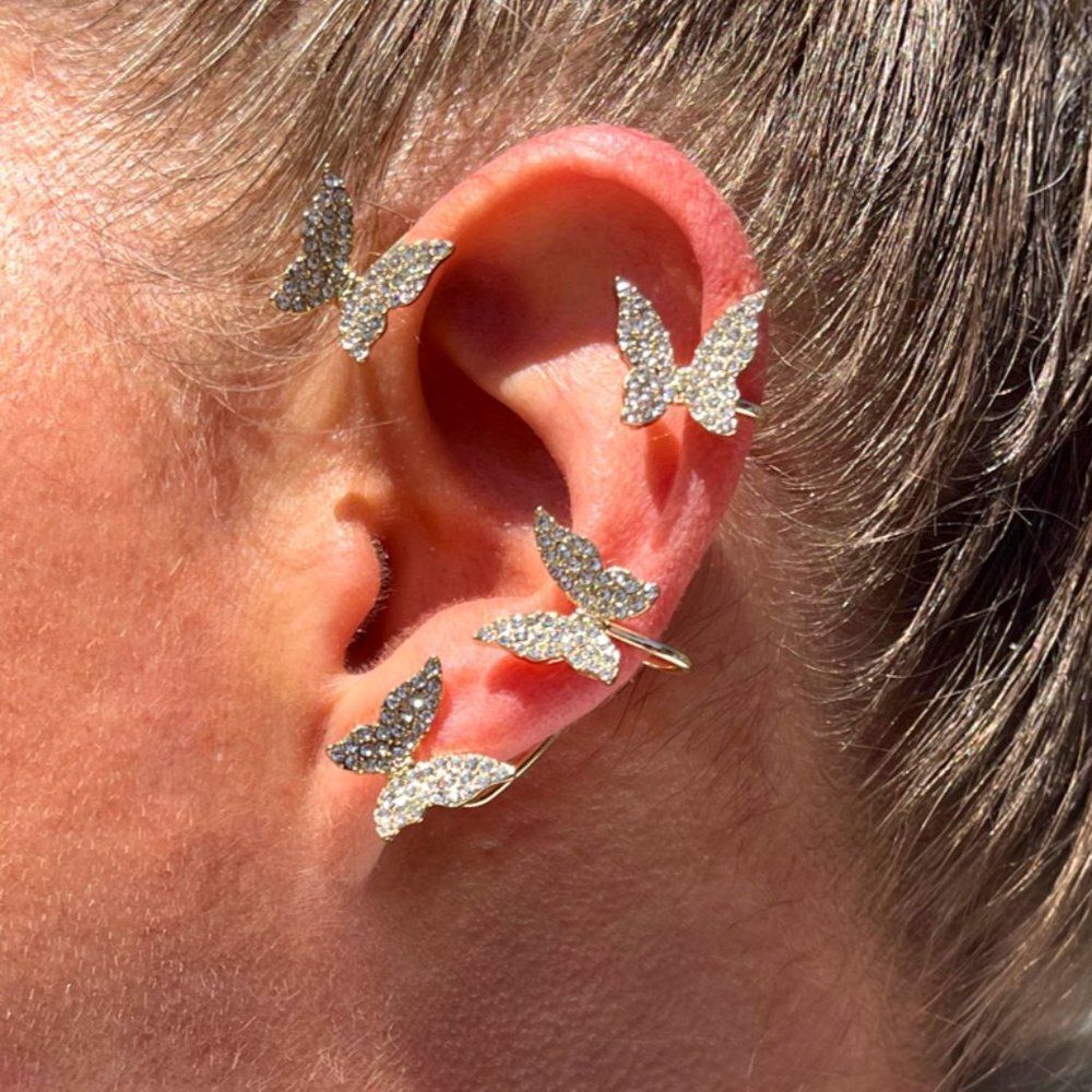 NWOT, gold tones and CZ charming ear cuff with sparkly butterflies,